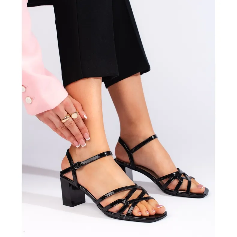 Black elegant low-heeled sandals by Sergio Leone