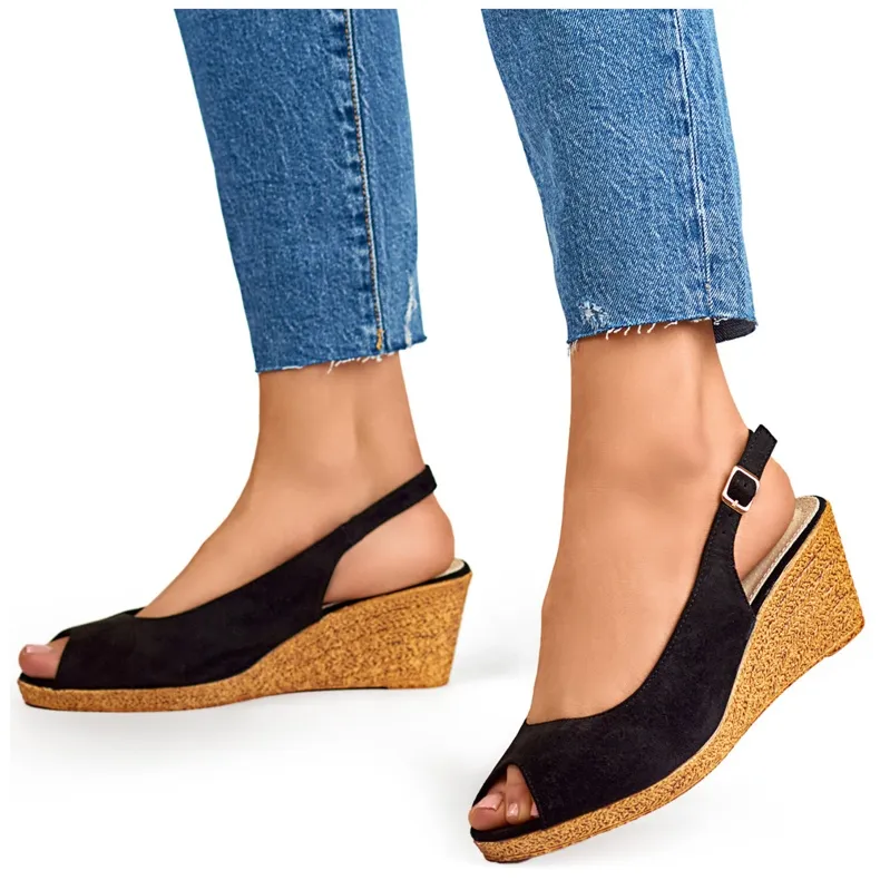 Ladies' black sandals on a low wedge